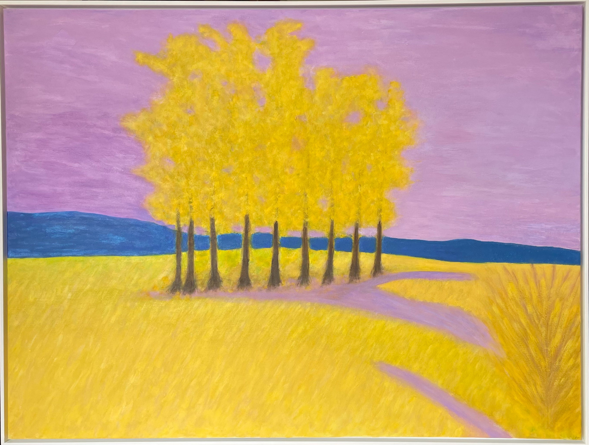 Row of yellow trees against a lavender sky, with a blue hill and a yellow field