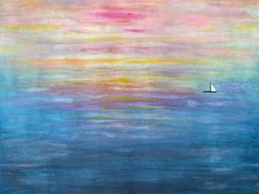 A small white sailboat on a calm sea at sunset