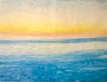 Yellow sunset light over a blue sea