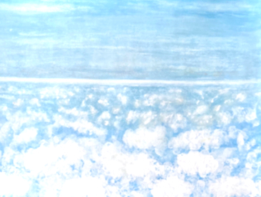 Soft white clouds below a pale blue sky and a bright horizon line
